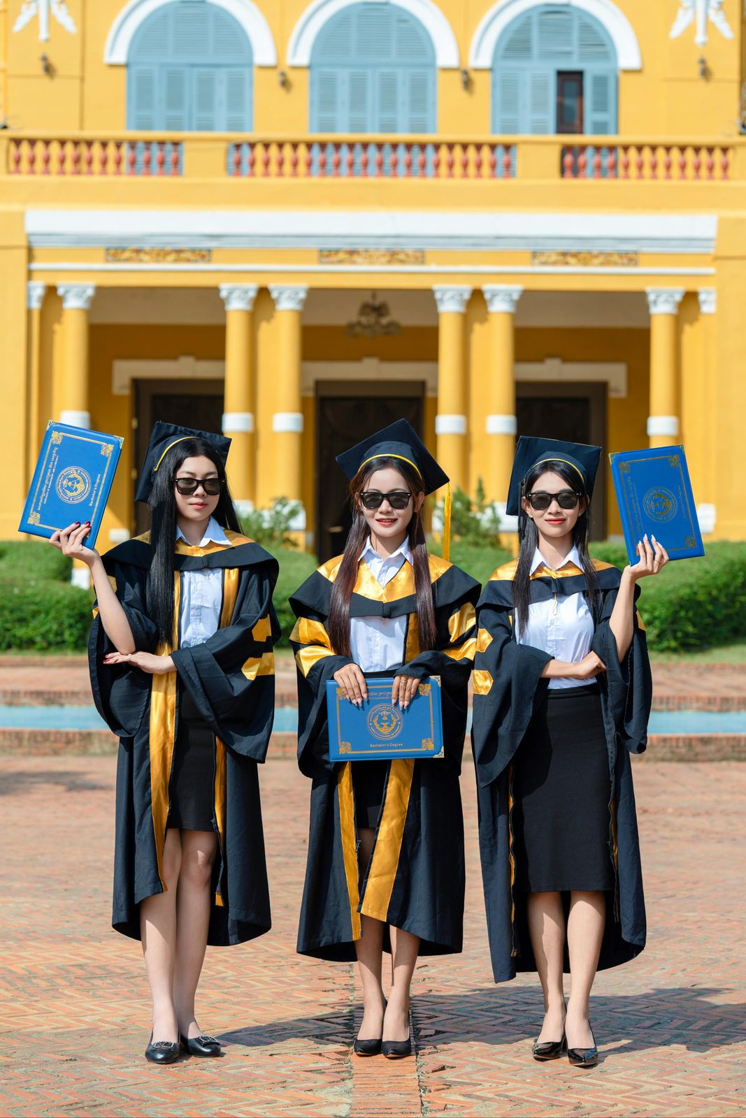 Graduates posing in caps and gowns