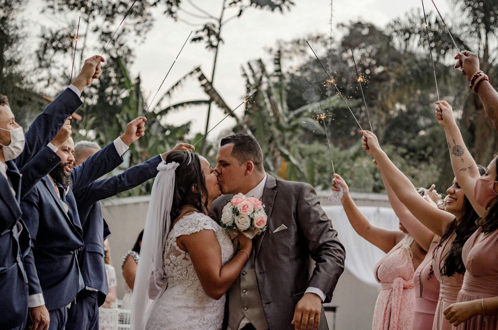 Bride and groom celebrating with sparklers
