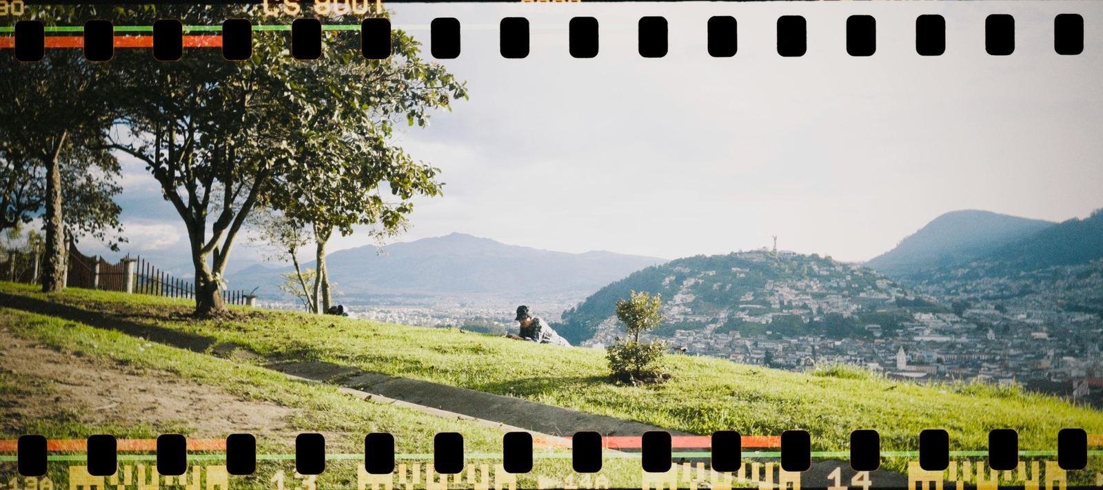 A 35mm film strip across a landscape